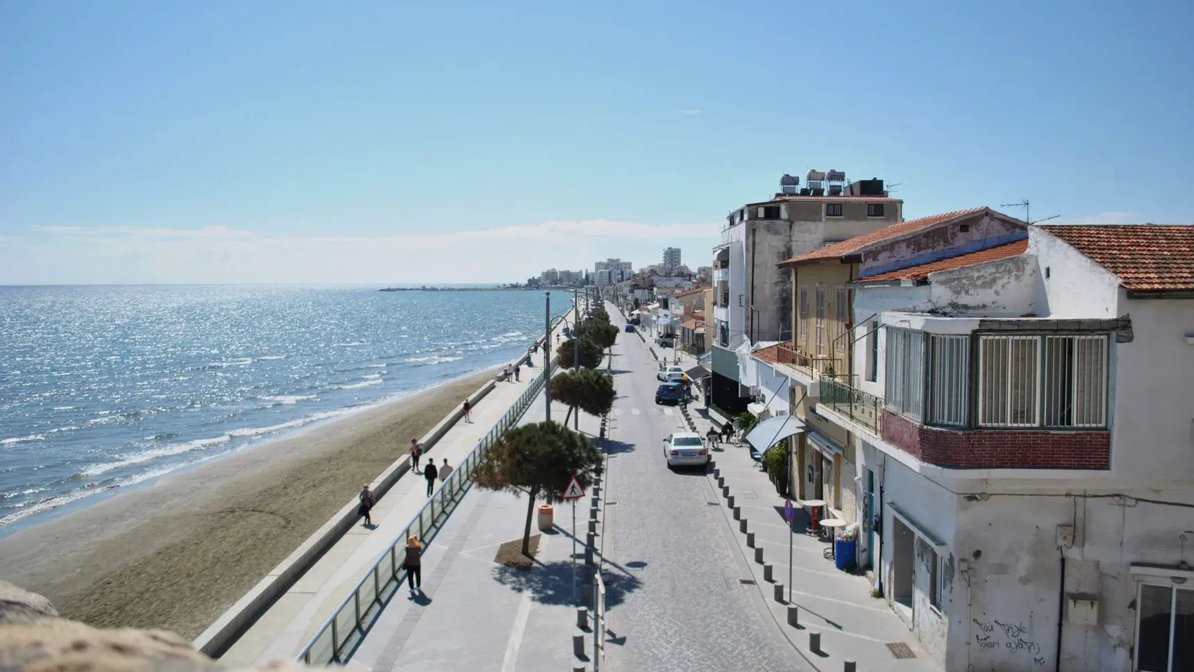 A coastal street in Larnaca, Cyprus, under a clear sky