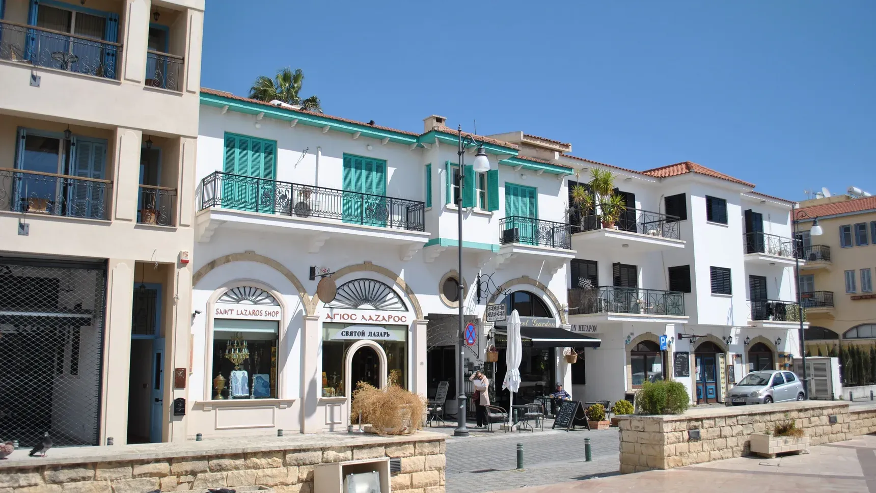 Shops along the seafront promenade in Larnaca, Cyprus, in bright daylight